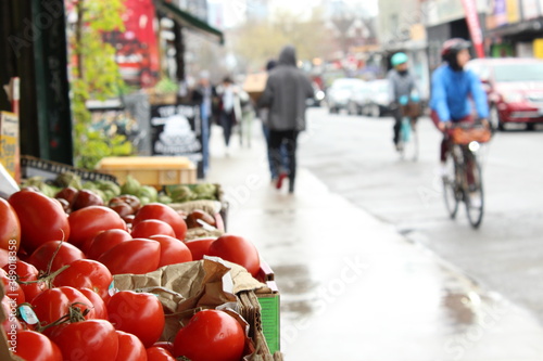Photography Fresh tomatoes are sold in the Kensignton Market, Toronto, on a rainy morning