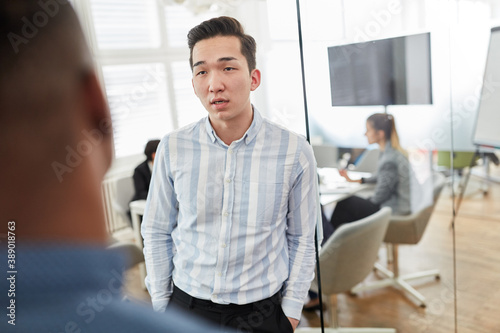 Young businessman as a trainee talking