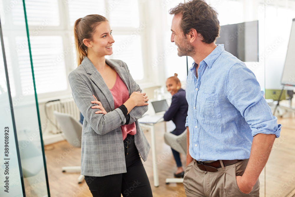 Fototapeta premium Young businessman is talking to a colleague