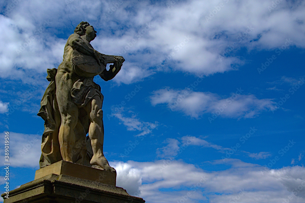 Romantic stone statue with the sky in the background