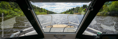 View from the cabin of the boat on the river in summer