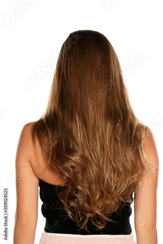 Back view of a woman with long wavy hair