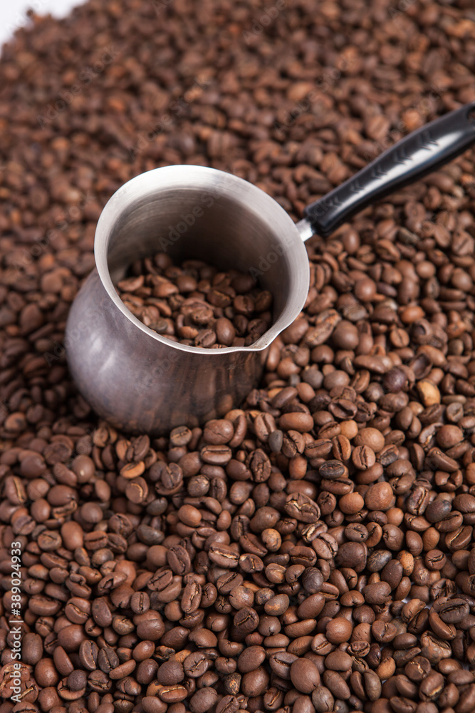 Cup of coffee on the coffee beans background