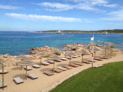 Beach  and sea with sun umbrellas of Sardegna, Italy