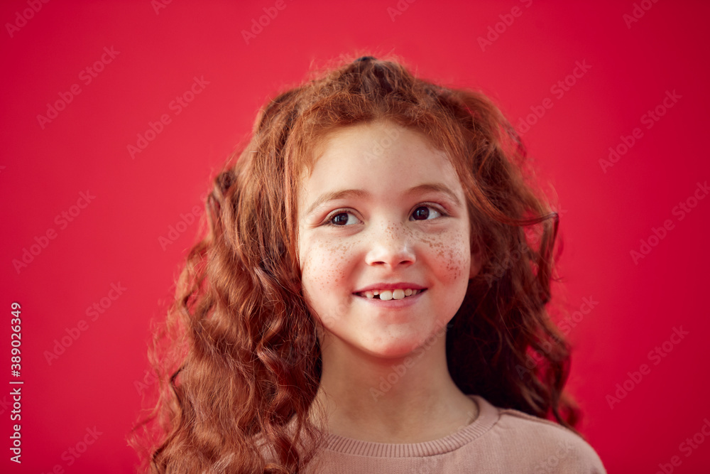 Portrait Of Girl With Long Red Hair Against Red Studio Background Smiling At Camera Portrait Of Girl With Long Red Hair Against Red Studio Background Smiling At Camera
