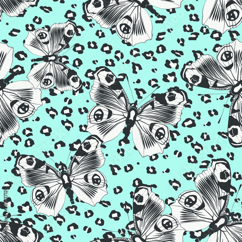 Seamless vector multicolor butterflies pattern. Butterfly on leopard print. Trendy animal motif wallpaper. Fashionable background for fabric, textile, design, banner, cover, web etc.