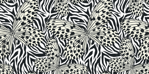 Seamless vector multicolor butterflies pattern. Butterfly on zebra print. Trendy animal motif wallpaper. Fashionable background for fabric, textile, design, banner, cover.