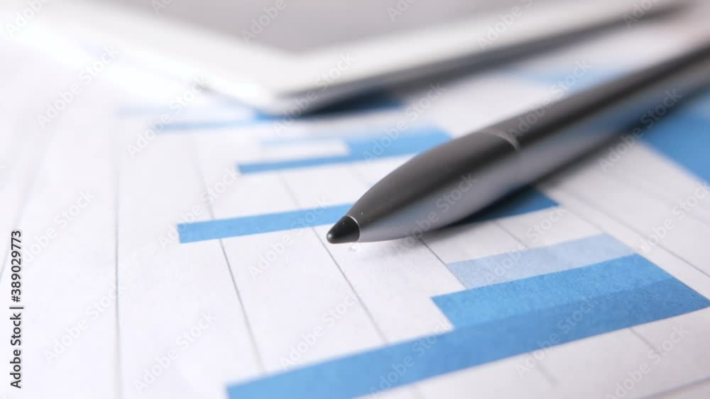 financial graph, calculator and notepad on table financial graph, calculator and notepad on table
