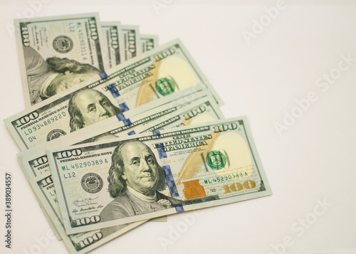 Stacks of paper 100 dollars USA on the white background