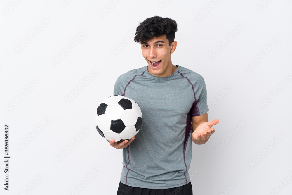 Argentinian football player man over isolated white background with shocked facial expression