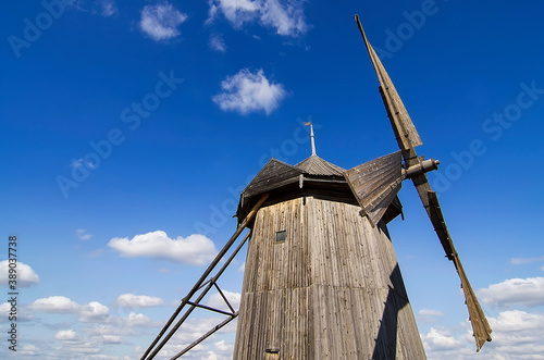 Old, wooden windmill. Ancient traditions. Household. Flour. Bread. Windmill (windmill). photo