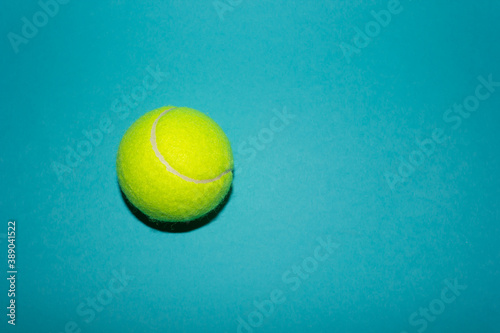 tennis ball on a blue background © Александр Звольский