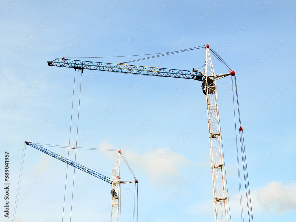 Construction cranes against the sky