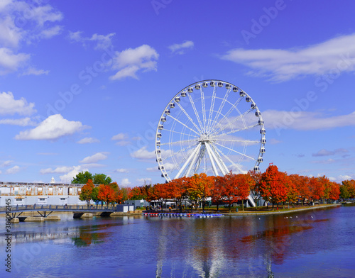 Autumn colors in old montreal and a beautiful view of Old Port wheel