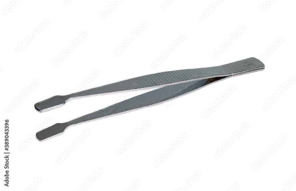 metal tweezers on a white background. close-up metal tweezers on a white background. close-up