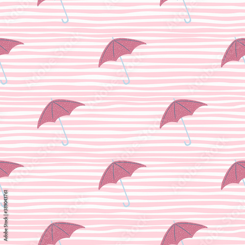 Simple little umbrella pink silhouettes seamless pattern. Light pink striped background. Fall season backdrop.