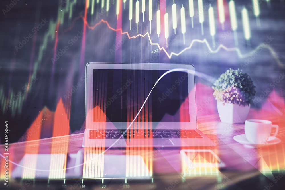 Stock market chart hologram drawn on personal computer background. Multi exposure. Concept of investment. Stock market chart hologram drawn on personal computer background. Multi exposure. Concept of investment.