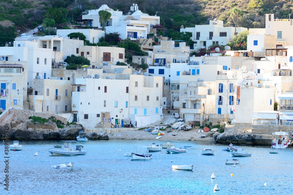 Island of Levanzo, Sicily, Italy, july 2020. This little sea town in the Egadi islanIsland of Levanzo, Sicily, Italy, july 2020. This little sea tos is wonderful with its white houses and blue windows