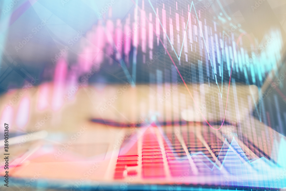 Financial market graph hologram and personal computer on background. Multi exposure. Concept of forex. Financial market graph hologram and personal computer on background. Multi exposure. Concept of forex.