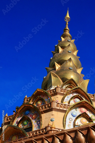 Golden pagoda decorated with stones of various colors.
