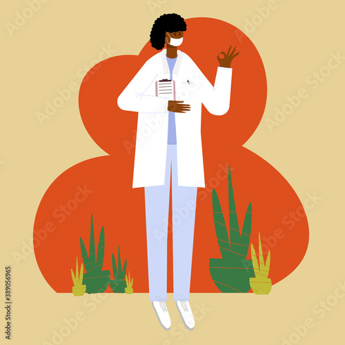 Black female doctor smiling and making a gesture of presentation