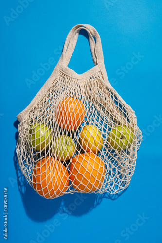 mesh shopping bag in the blue background.