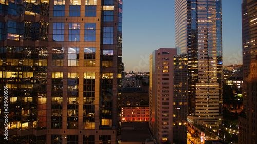 View of skyscrapers lighting up at night from hotel window in Seattle, Washington
