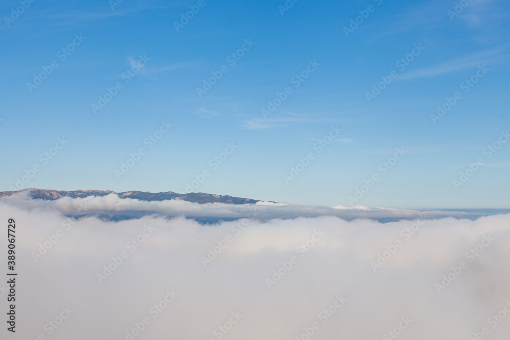 Mountain top above the clouds