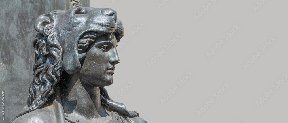 Banner with old statue of a sensual woman warrior, Amazonian, as defender with lion head and club at the Neumarkt in downtown of Dresden, Germany, with copy space for text.