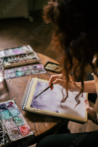 artist is painting artwork