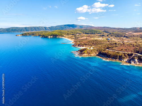 Church and sea with beach and mountains in Nea Roda © frimufilms