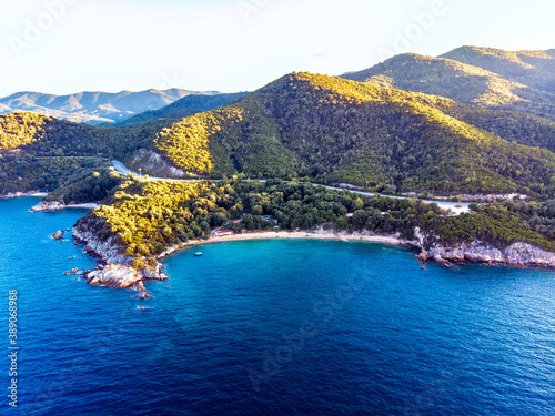 Drone panorama of sunset in Halkidiki with blue sea and mountains