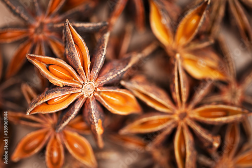 Abstract aniseed aromatic background. Anise stars condiment close up. Natural food texture.