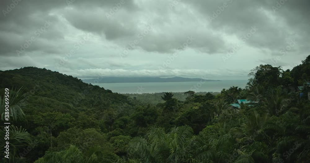 Timelapse of rainy tropical island mountain view with moving clouds Timelapse of rainy tropical island mountain view with moving clouds