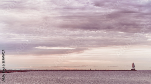 Old lone lighthouse at suns...