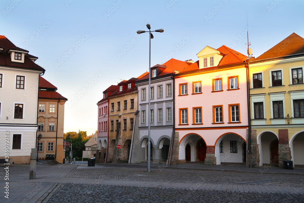 Small Square (Male namesti) in Hradec Kralove city, Czech Republic, bohemian region with its typical historical archway buildings. Dusk in the city.