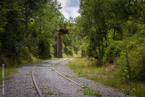 Old railroad tracks to transport coal from the mines of the Leonese mountain, Cistierna, León, Spain photo