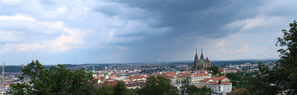 Aerial view of Brno city with dark cumulus clouds above. The rain and storm is comming. Petrov, Cathedral of St. Peter and Paul. South Moravia, Czech Republic.
