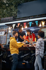 friends having fun at fast food mobile service