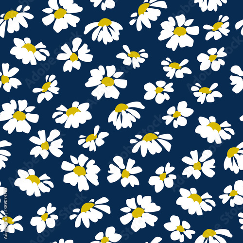 Seamless pattern. Chamomile flowers on a blue background.