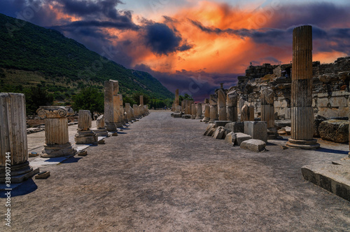 Ruins in the ancient Greek city Ephesus or Efes on the coast of Ionia sea in Selchuk, Izmir Province, Turkey at summer day. photo