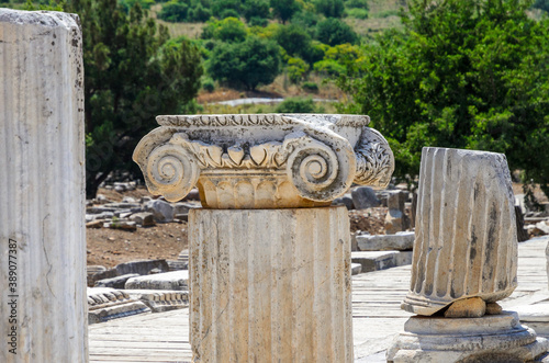 Ruins in the ancient Greek city Ephesus or Efes on the coast of Ionia sea in Selchuk, Izmir Province, Turkey at summer day. photo