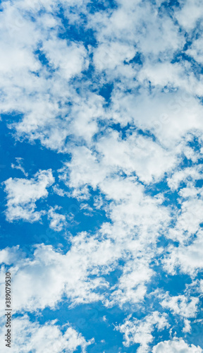 Photography Blue sky with puffy white clouds overhead