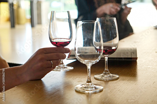 Wine glasses display at winery. Close up, copy space, background.