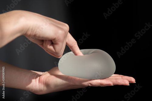 Silicone implant of the female breast during the demonstration of its quality.
