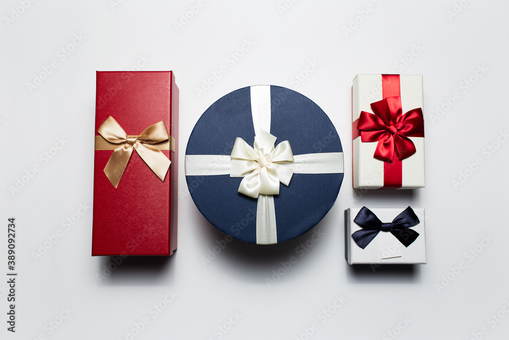 Close-up of colorful Christmas gift boxes isolated on white background.