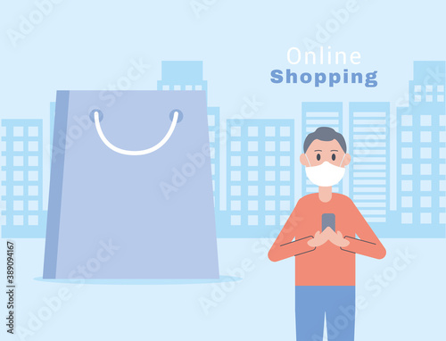young man wearing face mask online shopping