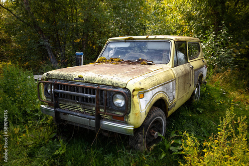 Classic old rusty 4x4 adventure truck in the forest