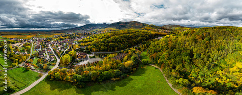A drone rises above a multi-colored valley in the Vosges.