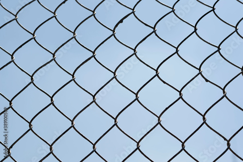 Link fence with blue sky